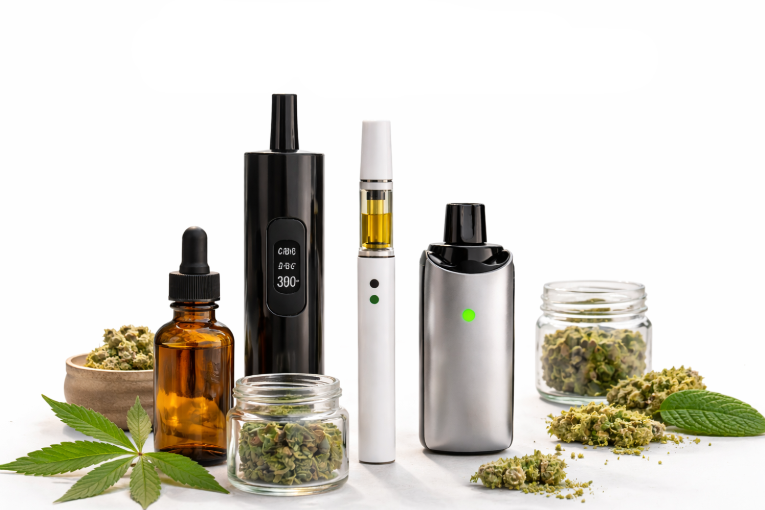 A collection of cannabis vaping products on a white surface, including multiple vape pens and cartridges filled with golden oil, glass jars, a dropper, cannabis buds, and green leaves.