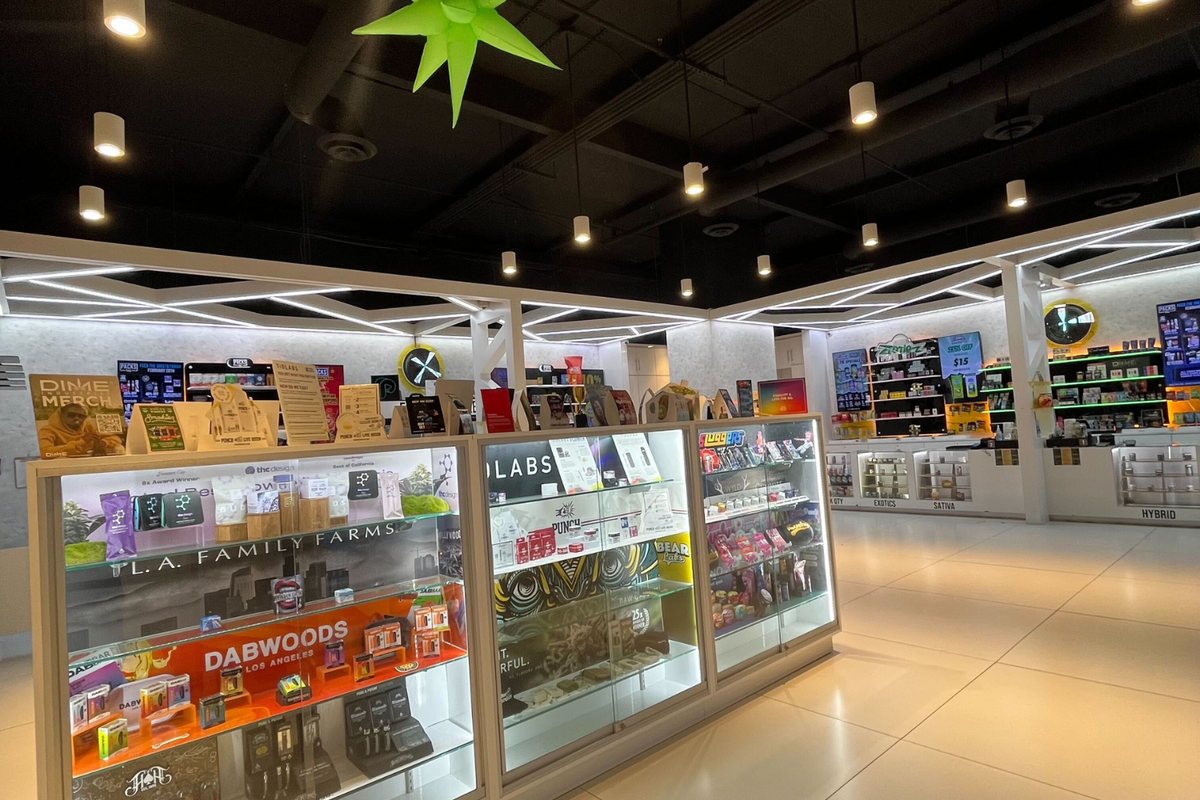 Modern PACKS Club dispensary interior with glass display cases, cannabis products, and branded shelves for shoppers looking for the closest weed dispensary