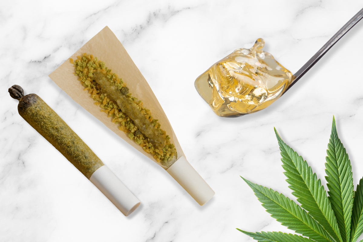 A close-up of a diamond infused pre-roll (joint) next to a golden cannabis concentrate, explaining what is an infused pre-roll.