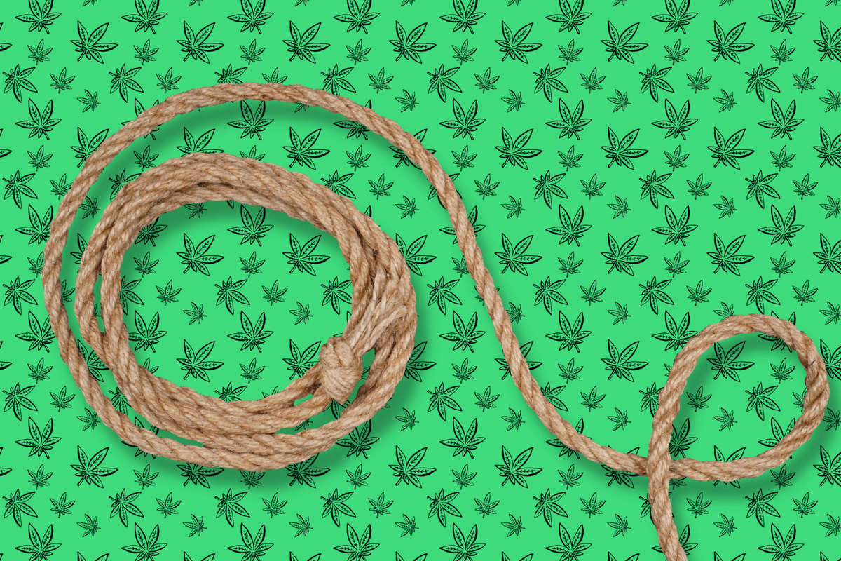 Coiled natural hemp wick on a green cannabis leaf background.