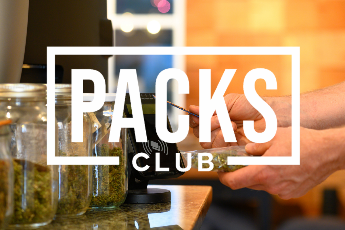 Cannabis flower being weighed at a dispensary counter