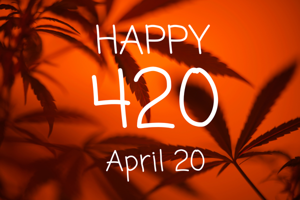 Silhouettes of cannabis leaves with text 'Happy 420 April 20,' symbolizing cannabis culture’s unofficial holiday.